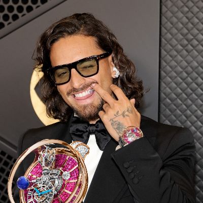 Colombian singer-songwriter Maluma wore a D&G tux with a million-dollar watch and 20k earbuds.